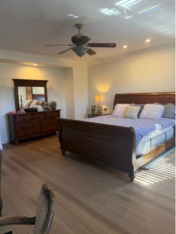 Wooden CA King Sleigh Bed with matching mirrored dresser and night stand