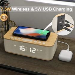 speaker and alarm clock with a magnet charger on the top area