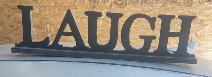 Black Wooden Laugh Sign
