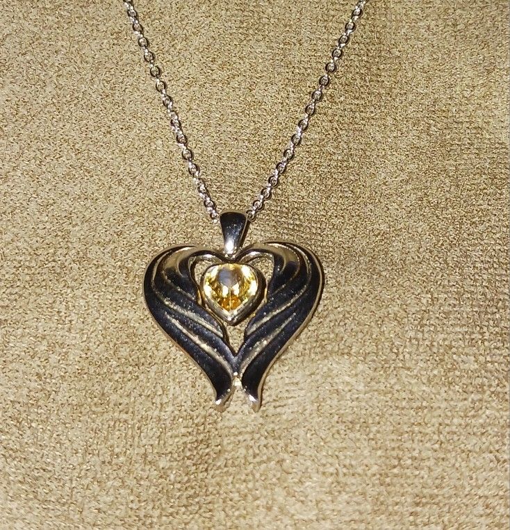 Sterling silver necklace with wing heart pendant 