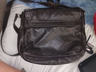 Gucci crossbody messenger bag. Brown leather, embossed, clean, like new. Serial number and model code tag inside.