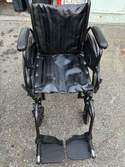 Black Folding Wheelchair with Footrests