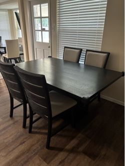 Black dining table. No chairs.