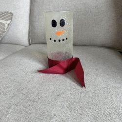 Beautiful snowman-themed glass jar, also referred to as a "Glass Jar Candle Snowman". Popular for holiday or winter decor and can be used with candles