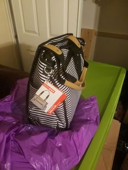Skip hop diaper bag still with tags . Washable