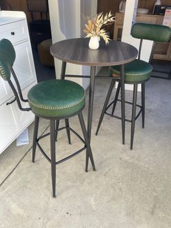 high table with two chairs
