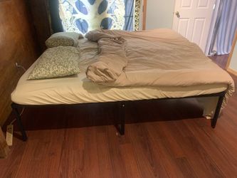 King size bed, and black metal bed frame, foam topper, fitted sheet, duvet and duvet cover,  4 pillow shams and 2 pillows
