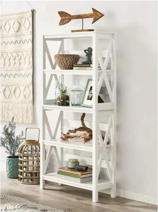 Contemporary, sleek book shelf / decor display cabinet. Has lovely X-design on the sides.
