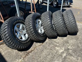 5 Goodyear 31/1050RX15 tires & 5 Jeep Cherokee XJ factory wheels