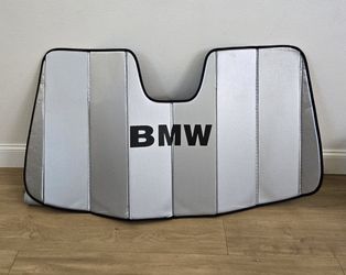 For Sale:
Used but still in good condition BMW sunshade for car/suv with holder