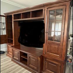 Solid Wood wall unit entertainment center with lights in glass cabinets
