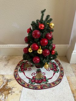 Small Christmas tree (ornaments included) with authentic Williamsburg festive skirt