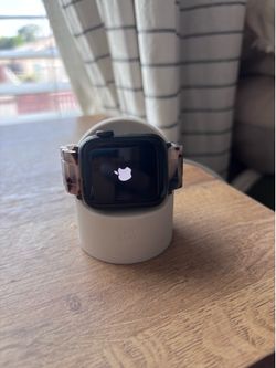Apple Watch + charger + tortoise shell band