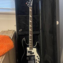 Bass Guitar With An Amp And Hard Case 