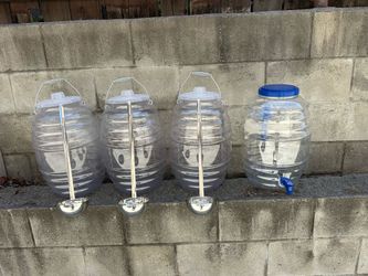 4 Five Gallon Agua D ispenser and Agua  Frescas Jugs