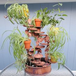 15-tiered copper water fountain with plant pots