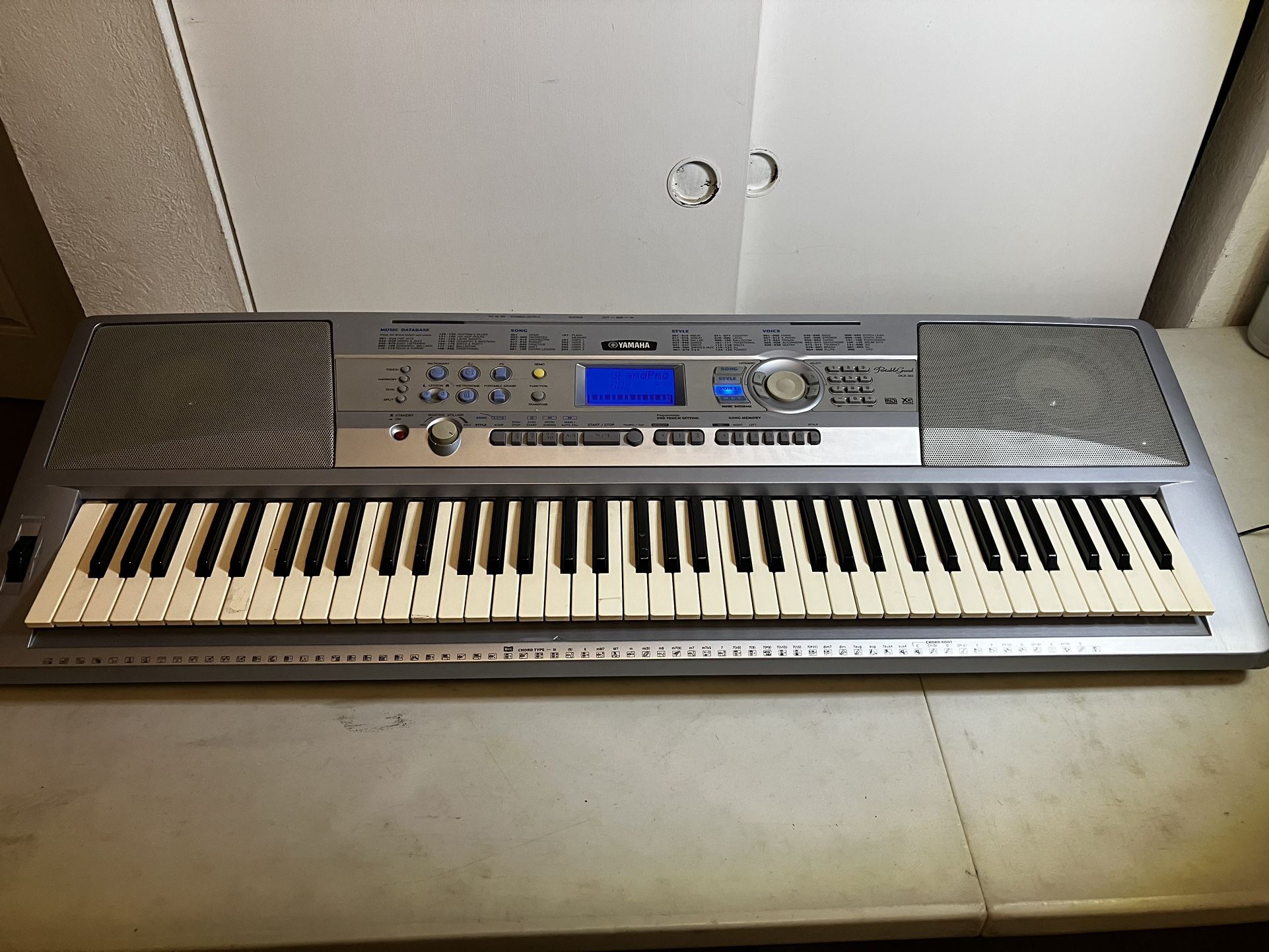 Yamaha Portable Grand DGX-202 Keyboard Piano w/ Stand - Power Supply   Good condition, as pictured, has power cord included but can run on batteries t