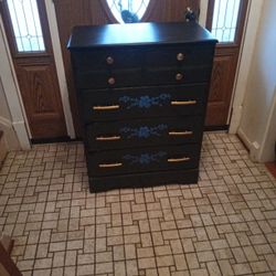 Black Dresser Four Drawer With Brass Handles/29 X 16 X 37.5 Inches.