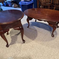 Two Solid Cherry Wood Tables. Used in a dining room.