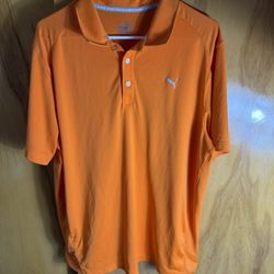 a Puma Essential Pounce men's golf polo shirt in orange