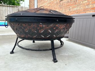 Outdoor fire pit with cover and wood