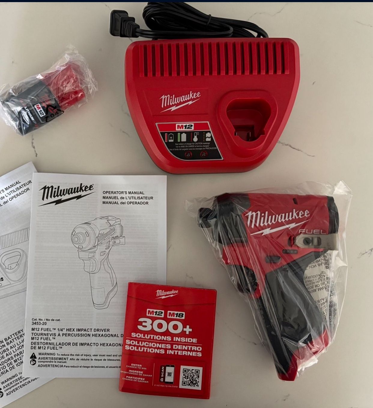 Milwaukee New Kit 1/4” Impact Fuel M12 , Battery And Charger