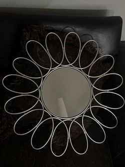 Mirror with metal frame