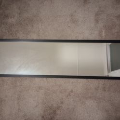 Plastic frame full body mirror.