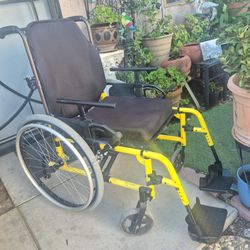 Ki Mobility Yellow Wheelchair up to 350 pounds.