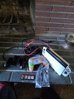 Nintendo OLED Switch 2 controllers with accessories.