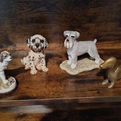 Four Cute Figurine Dogs