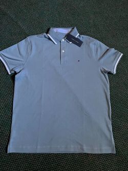 A Blue medium Tommy Hilfiger collared  shirt