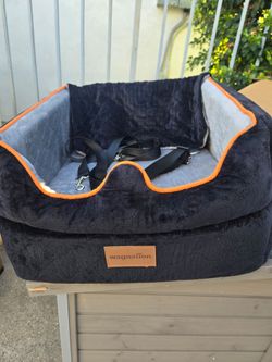 Small Pet Car Seat – Sturdy, durable booster seat for puppies; offers a wide view (great for sightseeing) and is washable.