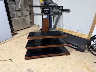 Excellent condition TV stand supports 55 to 60 inch TV