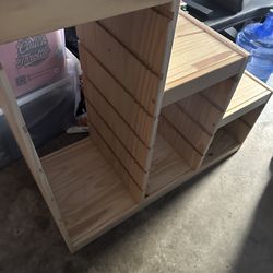 Storage shelves for kids toys or for miscellaneous items .