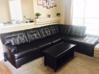 Leather sectional sofa and lift top coffee table on sale .Cash Only