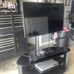 Samsung Tv, Tv Stand, Sound Bar And DVD Player