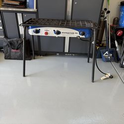 Camp chef three burner stove, grill box, griddle, storage bags for each, and cover when  outdoor camping