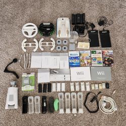 Nintendo Wii Accessories And Manuals (Battery Packs, Motion Plus Grips, Wheels, Charger Docs And More)