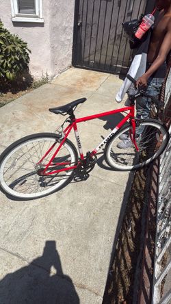 Red fixie with white walls rides smooth!