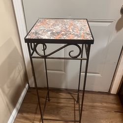 Wrought iron and tile pedestal plant stand