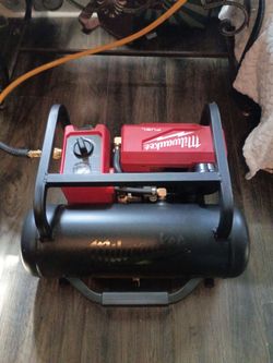 200 lb PSI Milwaukee air compressor with 50 ft hose nail gun