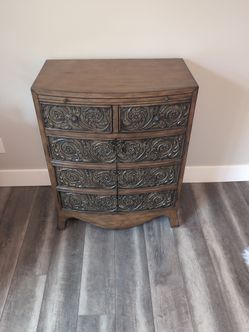 Chest with raised pattern front. Located in Lakebay past Gig Harbor