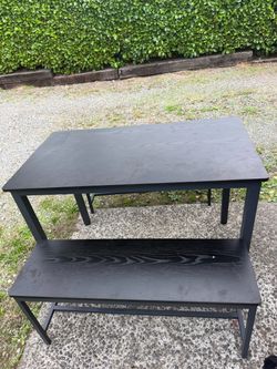 Metal black table with bench chairs