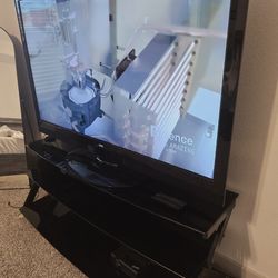 Tv 65" and tv stand, 1 table