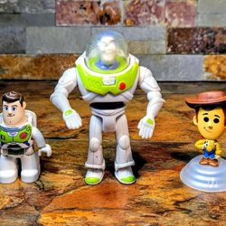 3-Lot Collection Of Vintage Disney Toy Story Figures • Center One Is A 1996- Burger King Kid Meal LightYear • The One On Left Is Toy Story  Imaginext 