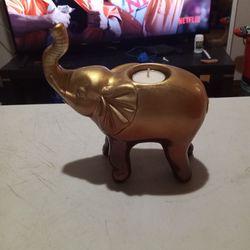 A Gold Elephant Candle Holder