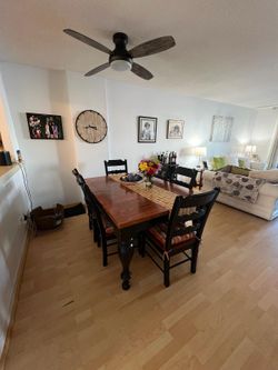 Wooden dining  room table with chairs