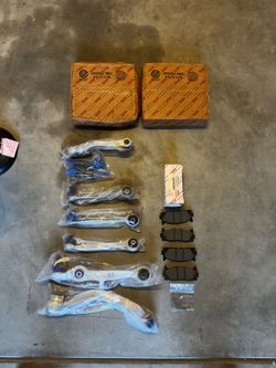 Brand new OEM Toyota suspension and brake parts kit for Toyota Camry.