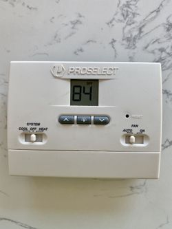 Thermostat with wall plate